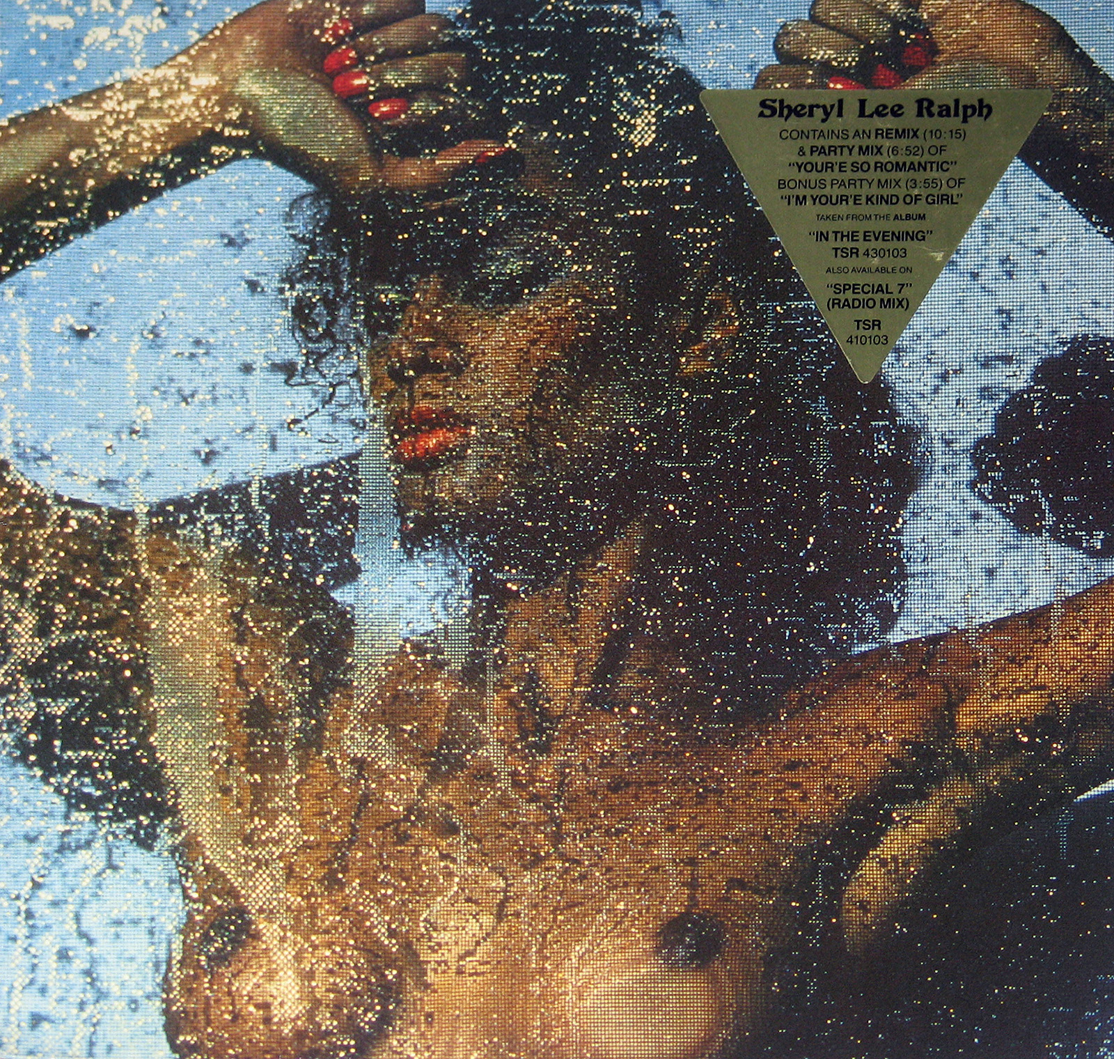 Sheryl Lee Ralph, posed nude behind a shimmering water curtain, striking a confident, glamorous pose for the 1980s EP cover You're So Romantic.